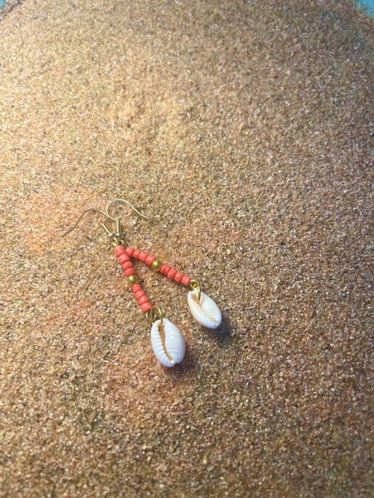 Pink and gold beaded earrings with cowrie shell