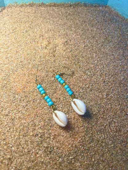 Blue and gold beaded Earrings with a cowrie shell