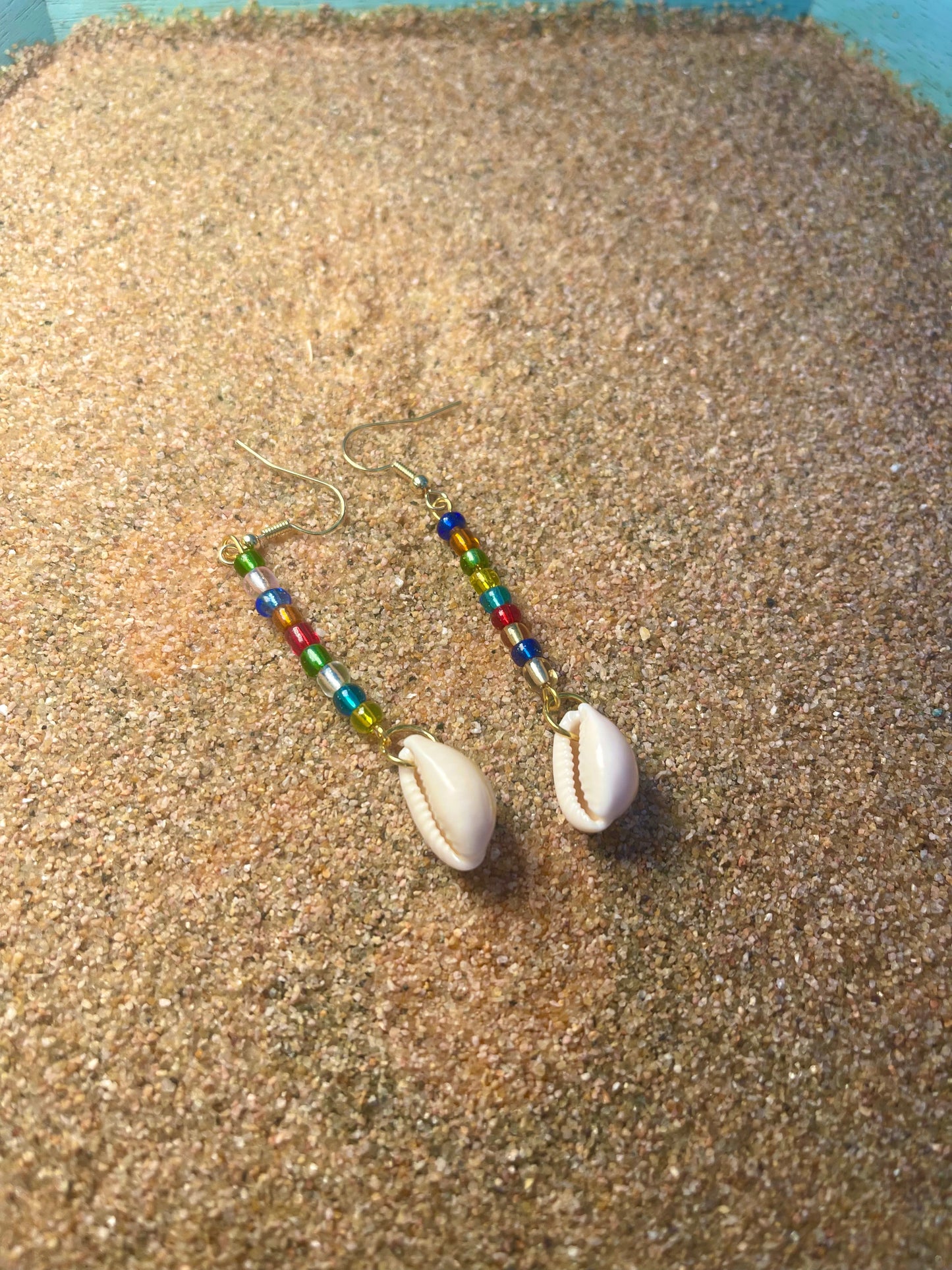 Rainbow beaded Gold Earrings with a cowrie shell