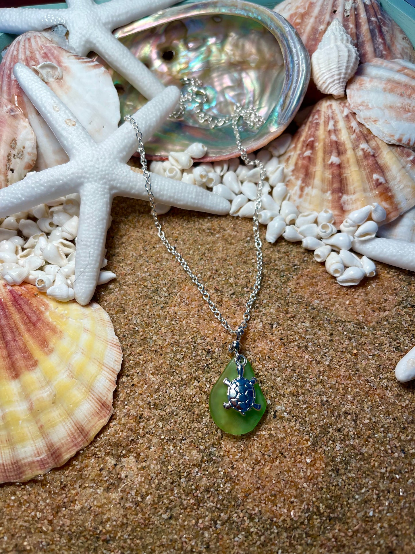 Silver necklace with green sea glass and a silver turtle