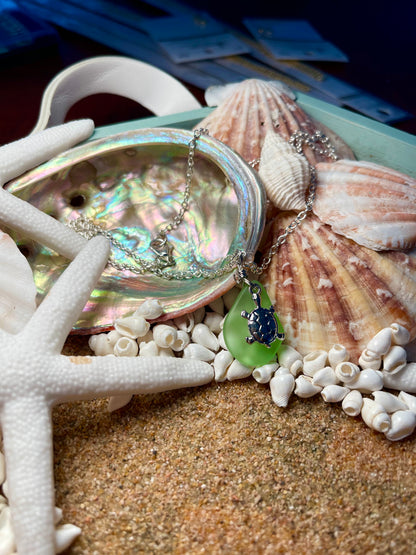 Silver necklace with green sea glass and a silver turtle