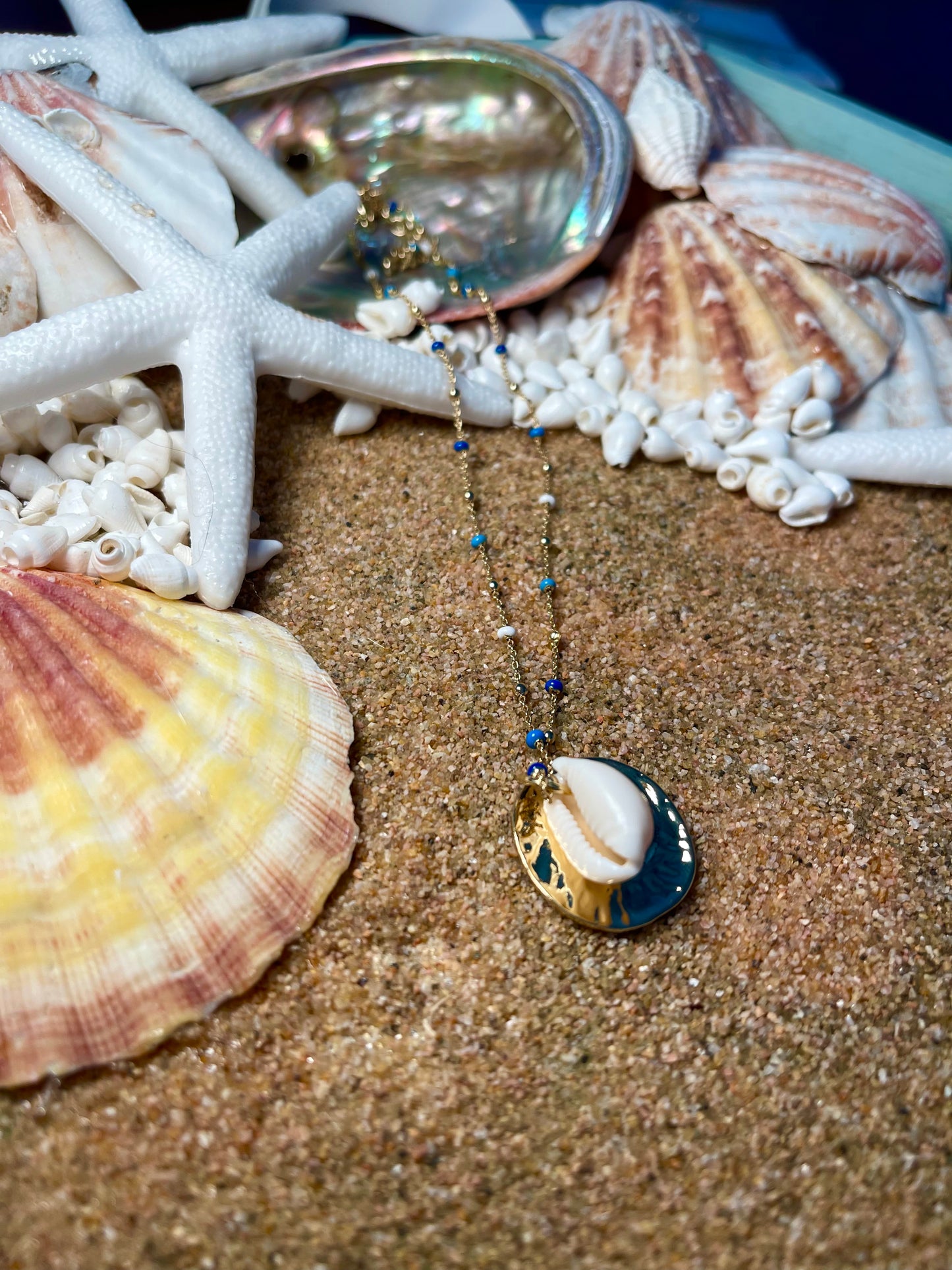 Blues and gold chain Cowrie seashell necklace