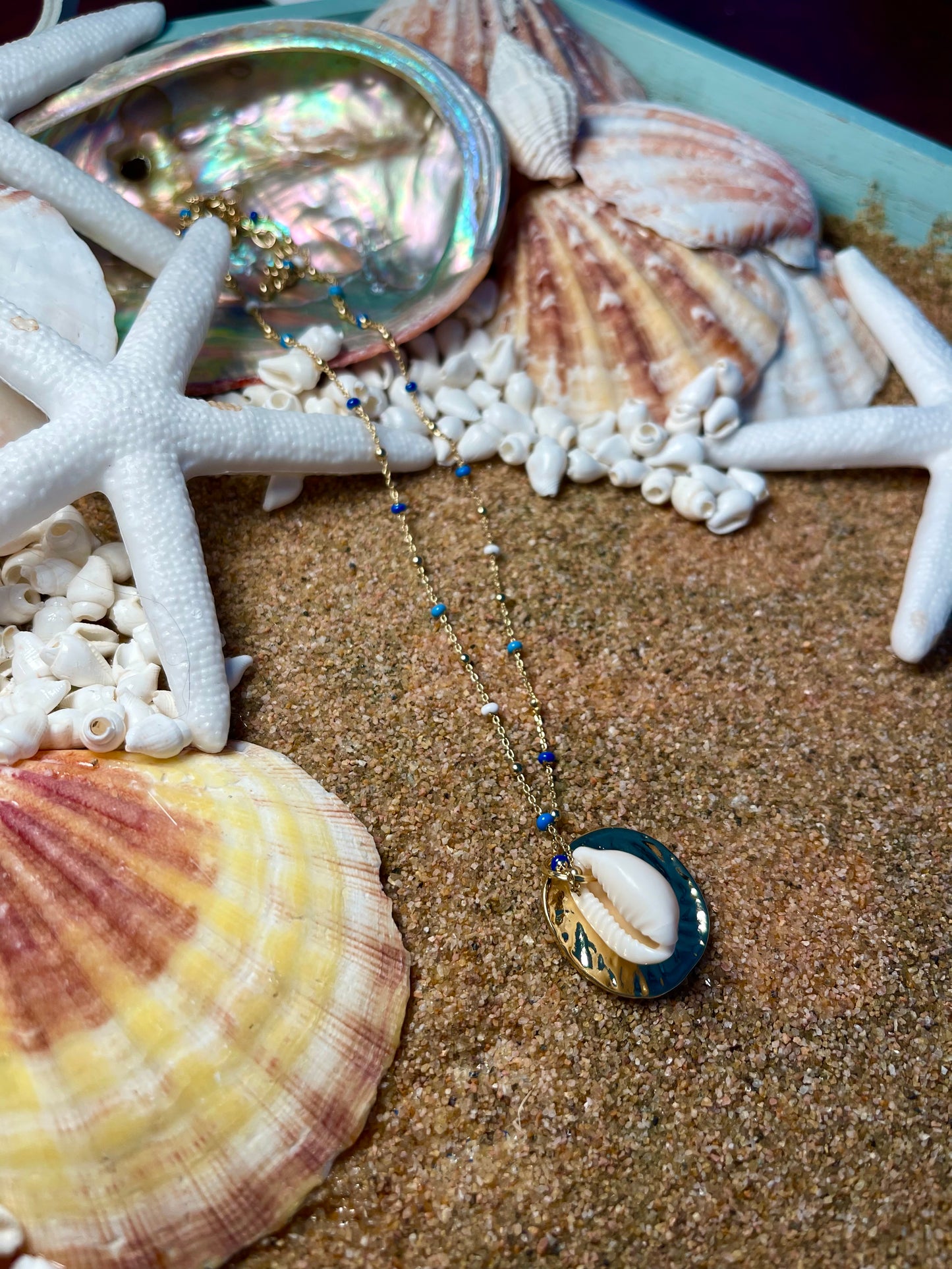 Blues and gold chain Cowrie seashell necklace