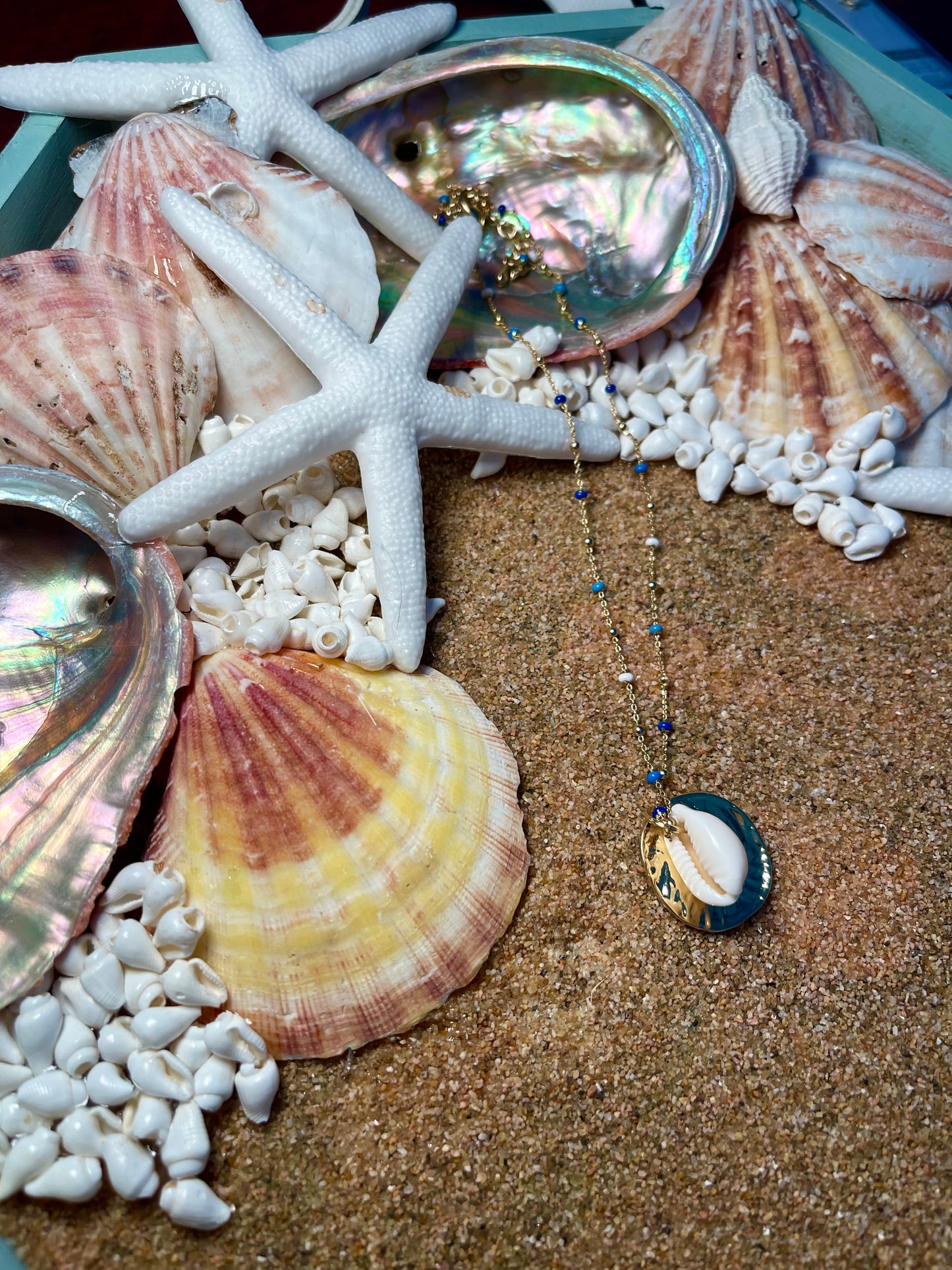 Blues and gold chain Cowrie seashell necklace