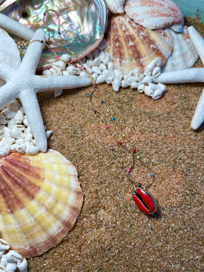 One of a kind. Gold and rainbow necklace with a Red cowrie shell