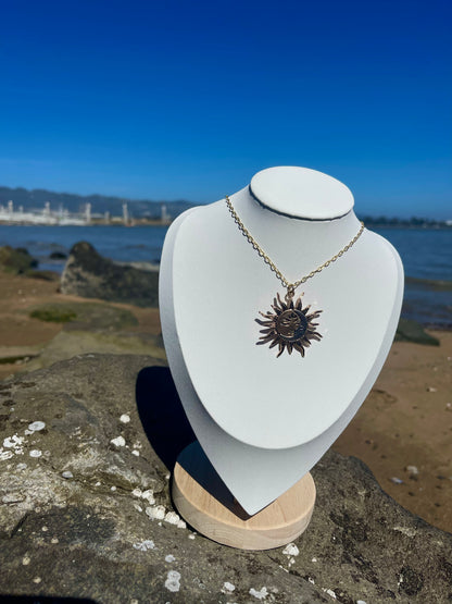 Gold and silver sun and moon necklace