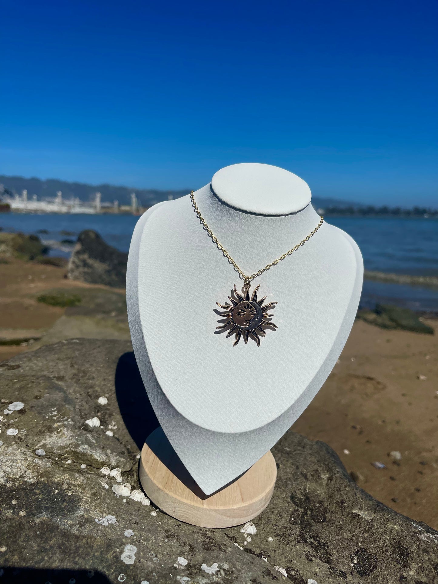 Gold and silver sun and moon necklace