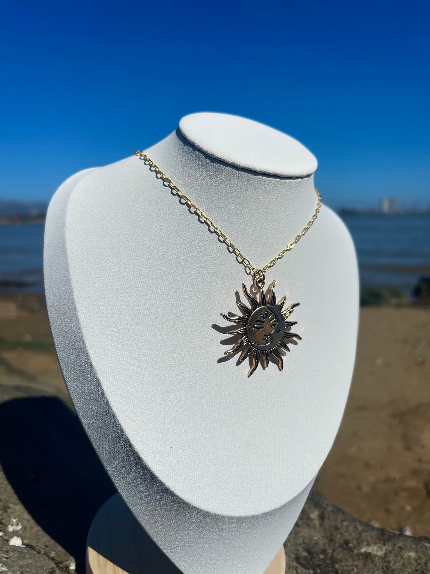 Gold and silver sun and moon necklace