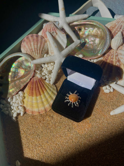 Silver sun and orange seashell ring