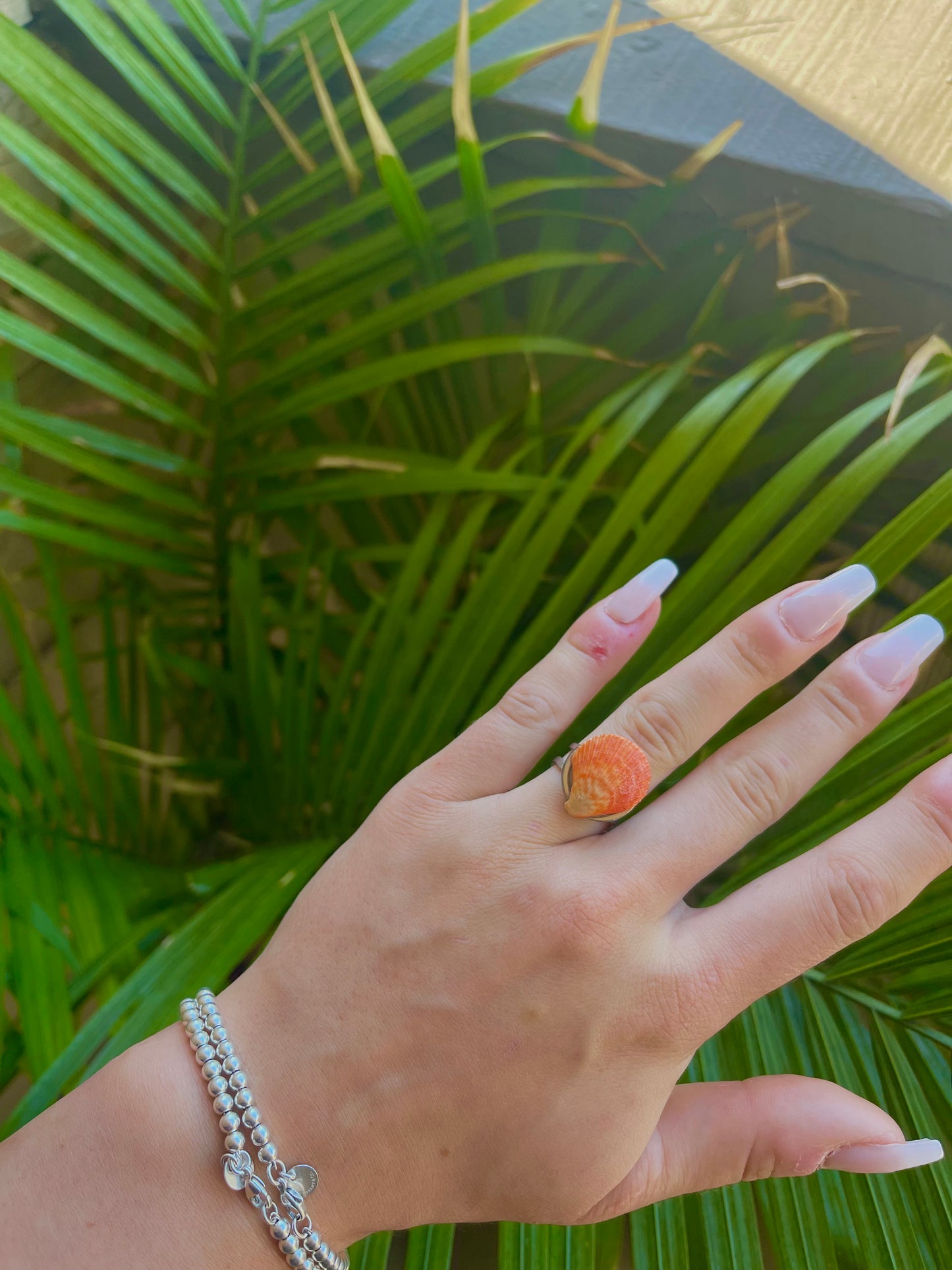 Bright orange seashell ring