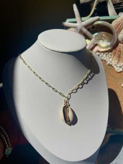 Gold cowry shell necklace