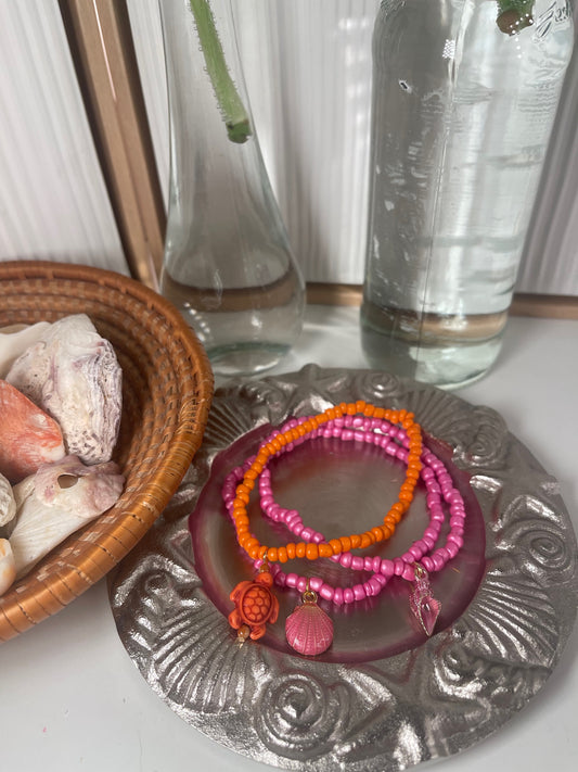 Repurposed Pink and Orange Bracelets With Seashell Charms